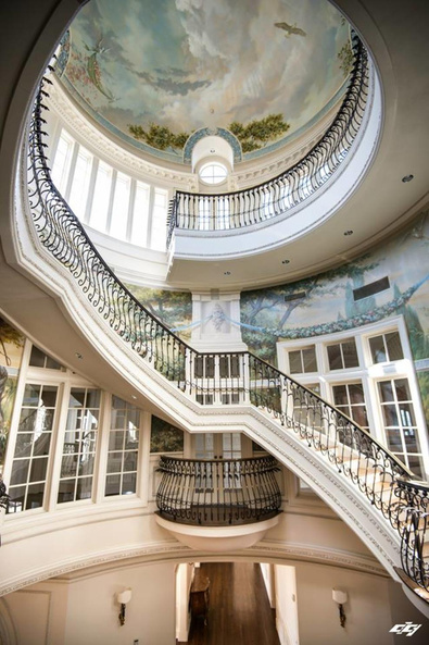 Grand staircase and painted dome inside The Olana